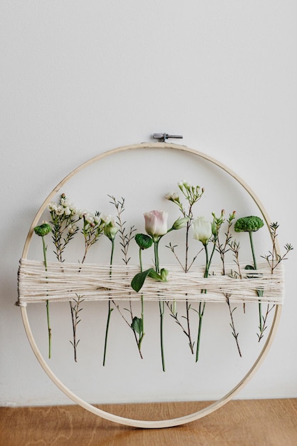 Three embroidered hoops displayed